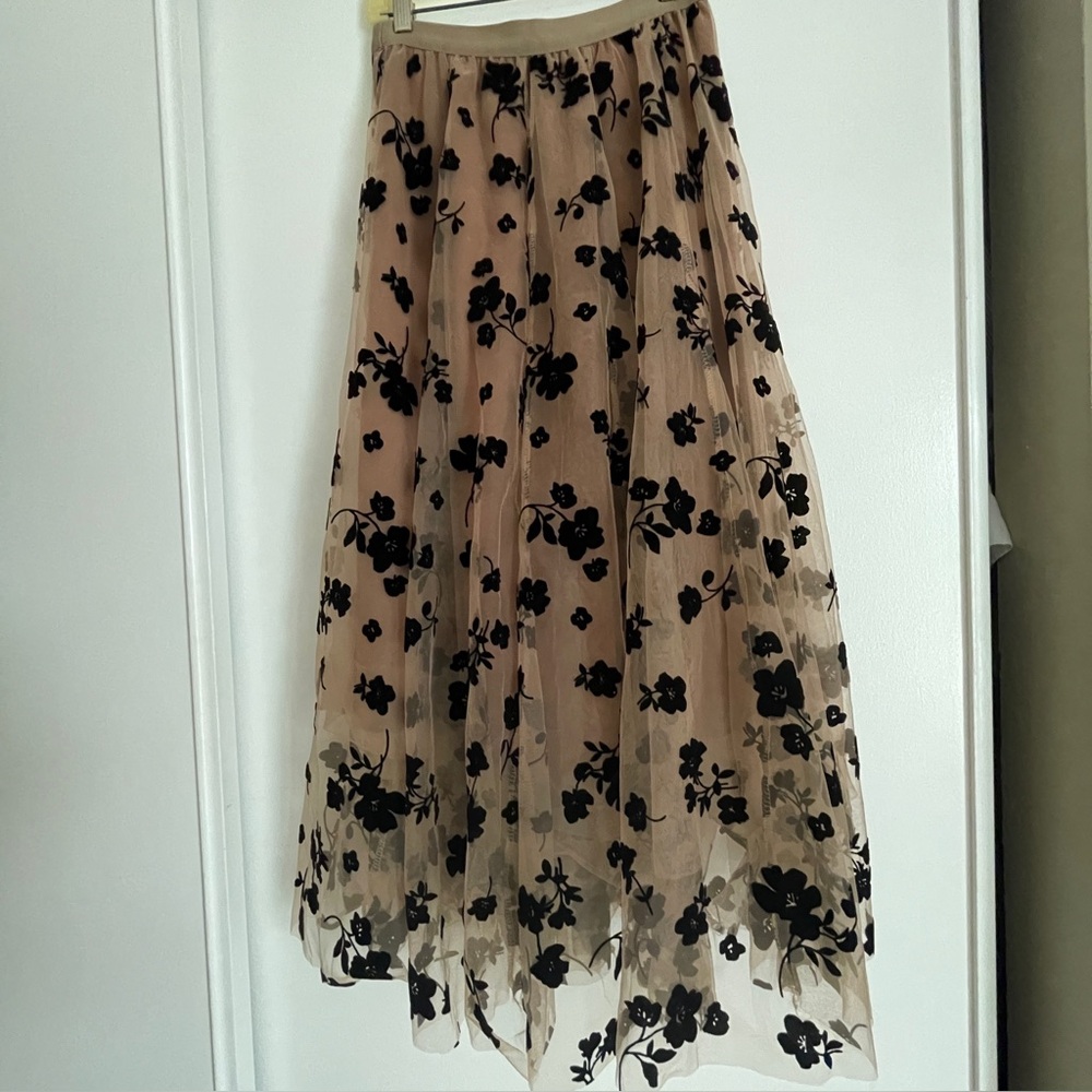 Sheer midi length tulle skirt with black flocked flower pattern, p/o waist